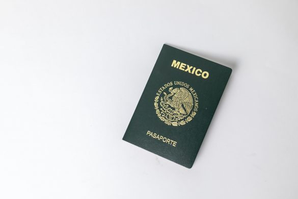 Top view of a Mexican passport against a white background with space for text